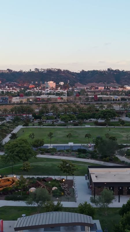 Civita Park Playground and Green Space Framed by Mission Valley Hills – Wide Establishing Frame (Vertical)