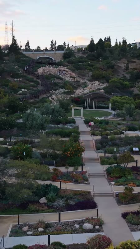 Civita Terraced Botanical Gardens and Winding Pathways at Twilight – Elevated Perspective (Vertical)