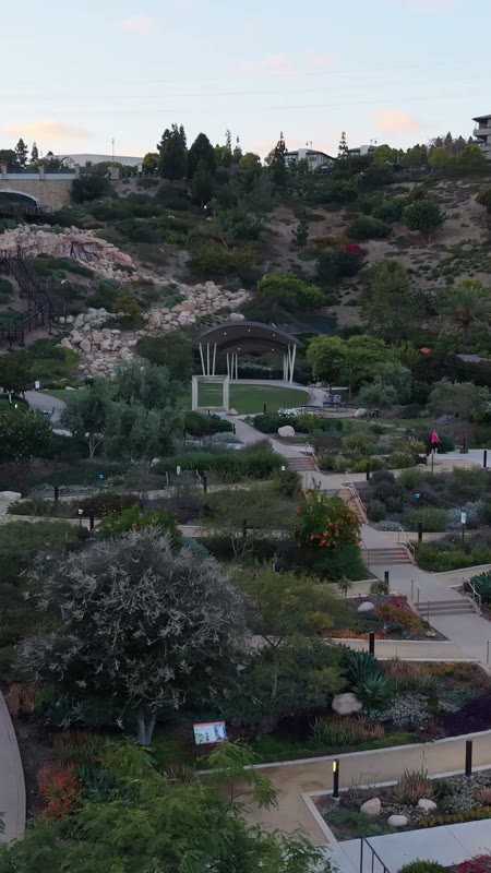 Civita Terraced Botanical Gardens and Winding Pathways at Twilight – Overhead Detail (Vertical)