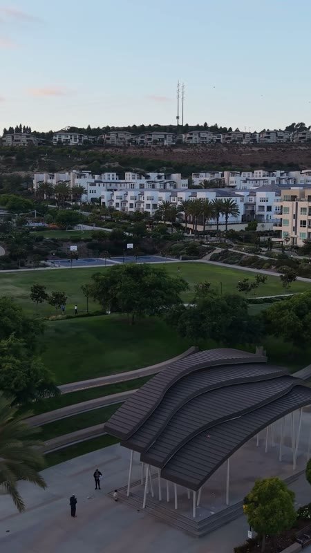 Civita Park Great Lawn and Flag Court Beside the Palm Promenade – Golden Hour Frame (Vertical)