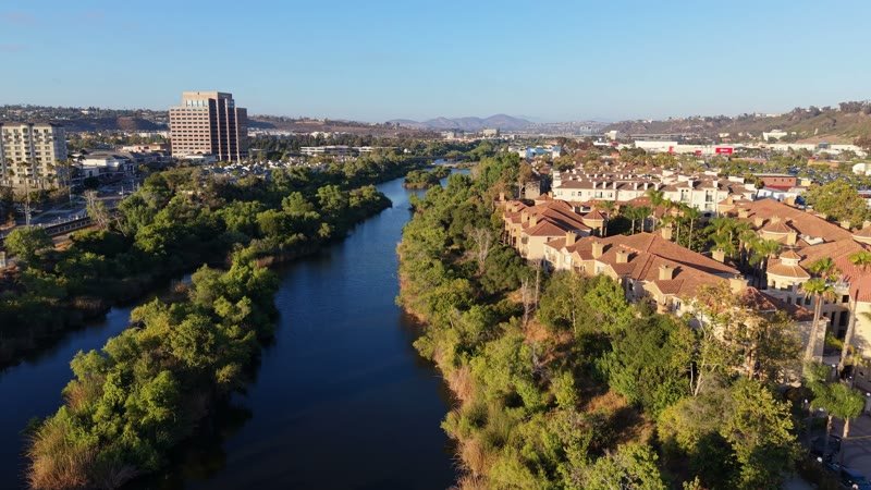 San Diego River Winding Past Riverside Townhomes in Mission Valley – Aerial View