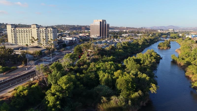Lush San Diego River Bend Below the Mission Valley Skyline – Wide Establishing Frame
