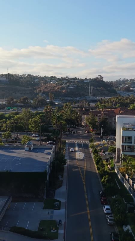 Mission Valley Streetscape with Apartments and Freeway Beyond at Morning – Aerial View (Vertical)