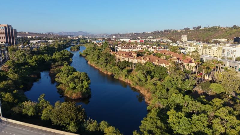 San Diego River and the Interstate 8 Bridge Beside Mission Valley Apartments – Wide Establishing Frame
