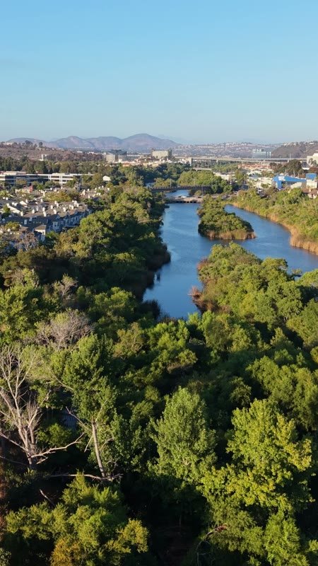 San Diego River Reflections Beside the Trolley Line and Office Tower – Aerial View (Vertical)