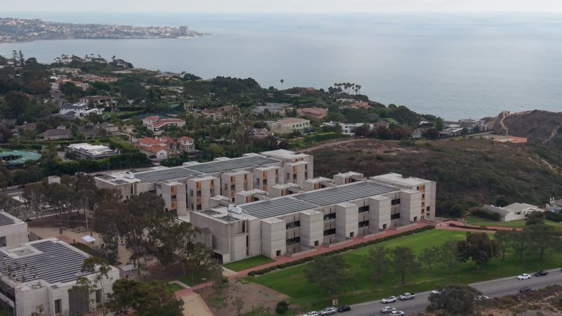 Aerial Profile of the Salk Institute Above La Jolla Shores – Wide Establishing Frame