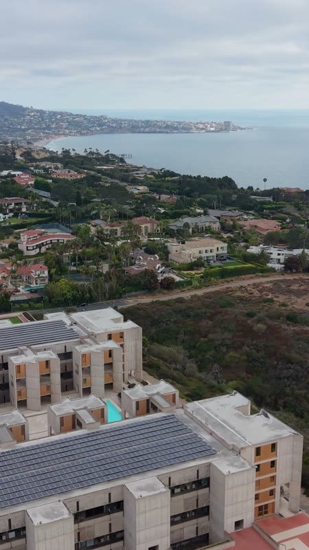 Salk Institute’s Twin Concrete Wings Above the La Jolla Bluffs – Wide Establishing Frame (Vertical)