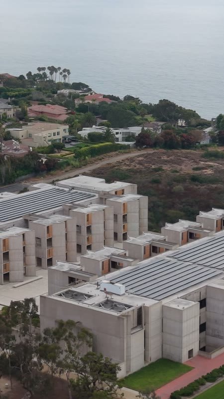 Aerial Profile of the Salk Institute Above La Jolla Shores – High-Angle Panorama (Vertical)