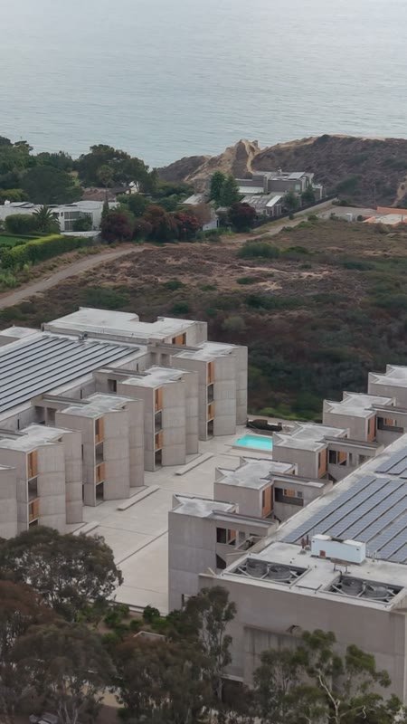 Aerial Profile of the Salk Institute Above La Jolla Shores – Birdseye Composition (Vertical)
