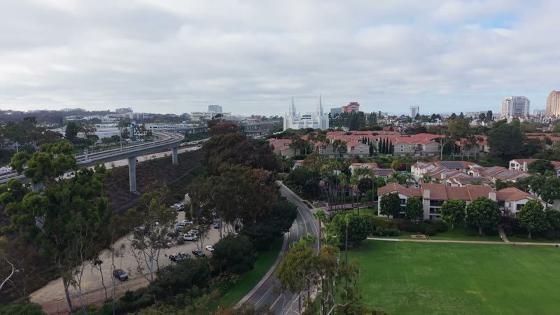 Distant San Diego Temple Spires Beyond the Trolley and Tree-Lined Canyon