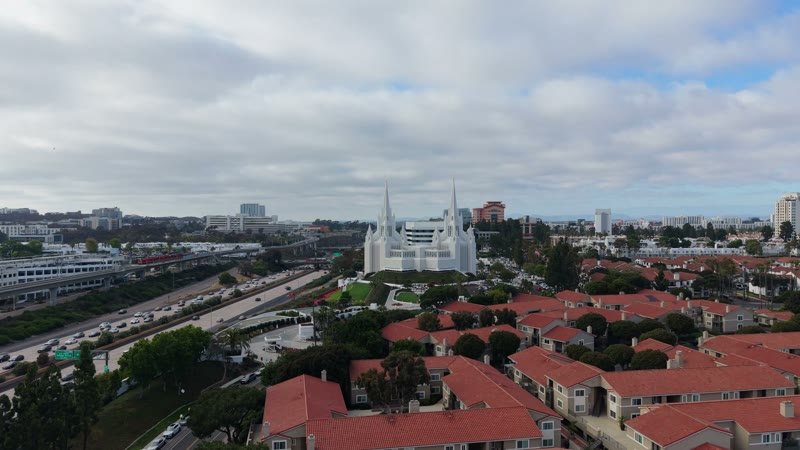 San Diego Temple Rising Beyond University City Rooftops – Aerial View