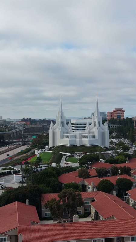 San Diego Temple Rising Beyond University City Rooftops – Aerial View (Vertical)