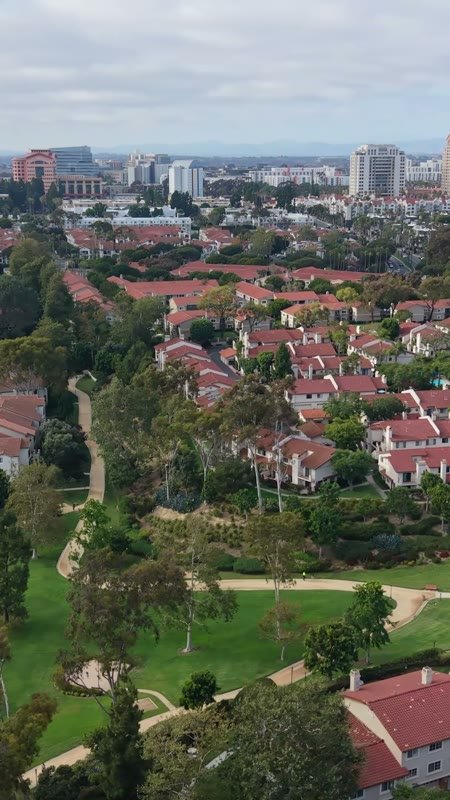 University City Neighborhood and Green Belt Beneath the UTC Skyline – Cinematic Drone Angle (Vertical)