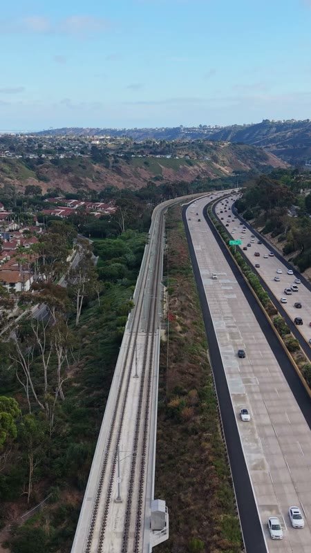 Interstate 5 and the Trolley Line Winding Through University City – Aerial View (Vertical)