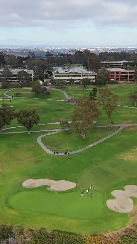 Golfers on the Green at Torrey Pines with the City Mesa Beyond (Vertical)