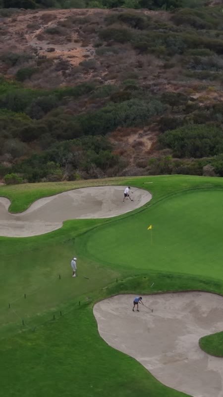 Golfers on a Clifftop Green Between Sculpted Bunkers at Torrey Pines (Vertical)