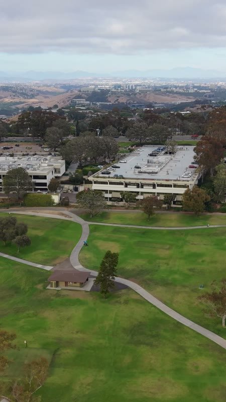 Torrey Pines Greens Beside the Science Park and Mesa Skyline (Vertical)