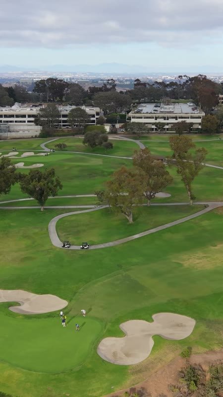 Golfers on the Green at Torrey Pines with the City Mesa Beyond – Wide Establishing Frame (Vertical)