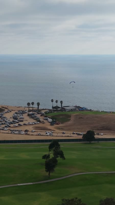 Torrey Pines Fairways with Paragliders Drifting Over the Sea – Golden Hour Frame (Vertical)