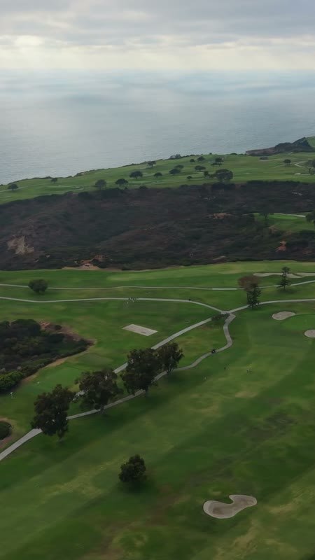 Clifftop Fairways of Torrey Pines Overlooking the Sunlit Pacific – Aerial View (Vertical)