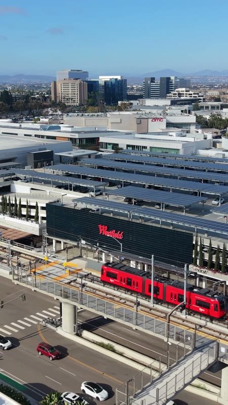 Red Trolley Passing Westfield UTC Along La Jolla Village Drive (Vertical)