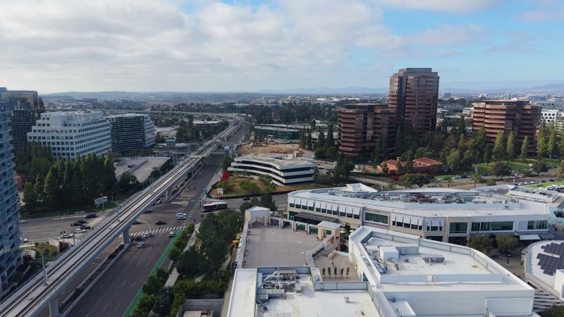 The Blue Line Trolley Threading Through University City’s Office District – Elevated Perspective