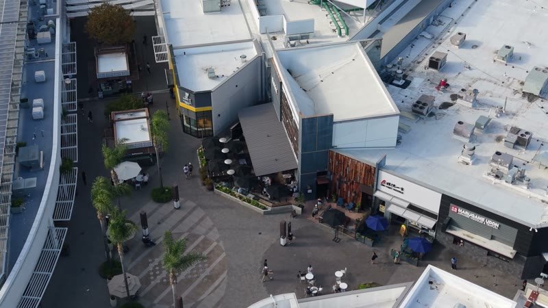 Outdoor Dining Terrace and Shops at University Town Center – Wide Establishing Frame