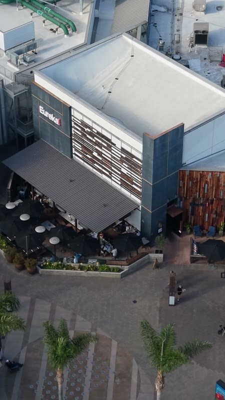 Outdoor Dining Terrace and Shops at University Town Center – Golden Hour Frame (Vertical)