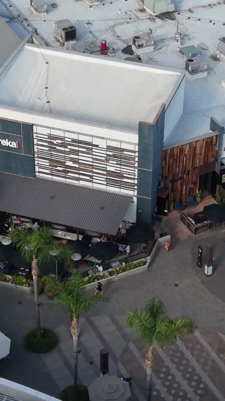 Outdoor Dining Terrace and Shops at University Town Center – Cinematic Drone Angle (Vertical)